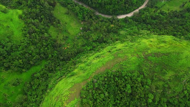 Scenic drone view of the Quitinday hill landscape in Camalig, Albay, highlighting the lush vegetation, rounded hills and expansive rural setting.