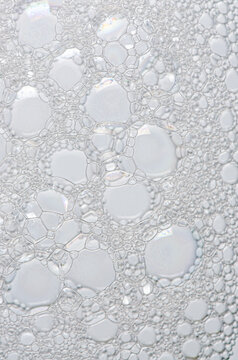 The texture of the foam of shower gel or soap suds. Macrophotography