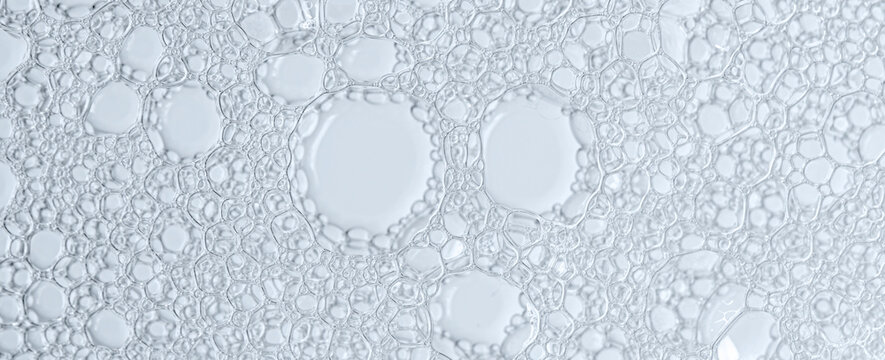The texture of the foam of shower gel or soap suds. Macrophotography