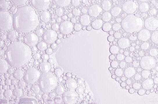 Bubbles of body gel or soap foam or shaving gel. Closeup.