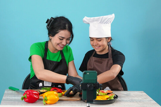 Happy Family Culinary Vlog Recording with Fresh Vegetables