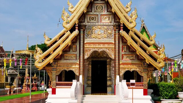 Slow Motion Tilt Up Shot of Viharn Phra Chao Lavo Exterior at Wat Phra That Hariphunchai