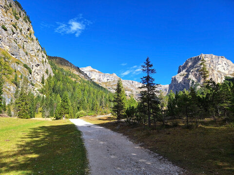 The winding Vallunga hiking trail among the rocks in the Puez Geisler nature park in Selva.