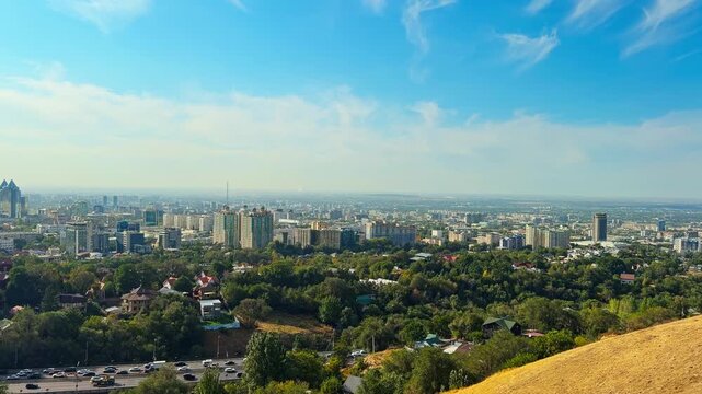 Panoramic Urban Landscape Of Almaty View From Kok Tobe Hill With Dense Neighbourhoods And City Buildings In Kazakhstan. Panning Shot