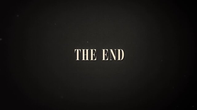 Static shot of vintage title card reading the end centered on dark textured background with sepia grain and subtle vignette, nostalgic closing moment