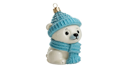 Cute little polar bear cub figurine wearing blue knitted hat scarf, isolated on transparent background. © Christopher