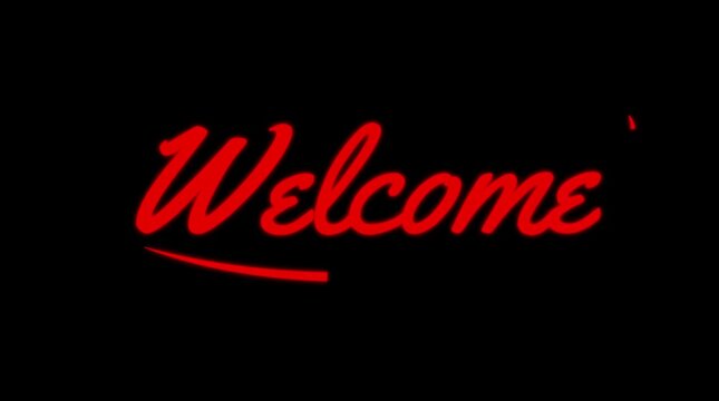 Bright red neon glowing welcome text message sign glowing dynamically against dark black background for entrance display