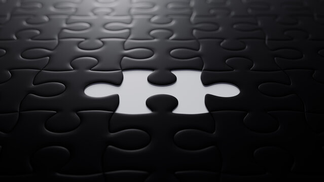 Close up of Black and White Jigsaw Puzzle Wallpaper focusing on the last piece to go into place. Completion Concept.