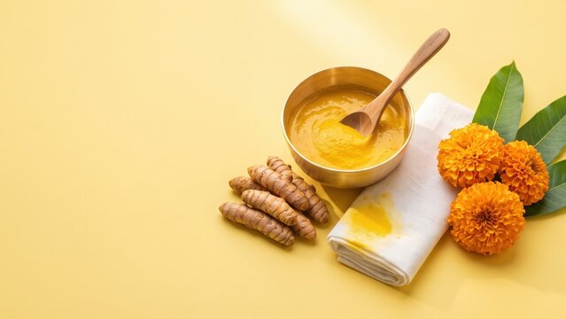 Haldi Ceremony Essentials with Turmeric Paste and Marigold Flowers &ndash; Indian Wedding Ritual Flat Lay.