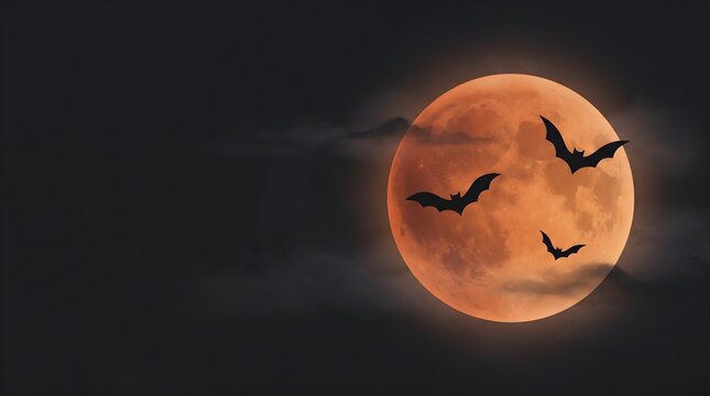 Dark bats flying across a glowing orange full moon in a dramatic night sky, creating a classic spooky Halloween scene.