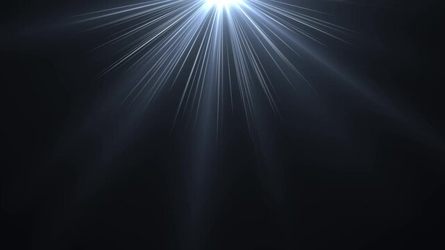 Bright blue overhead optical lens flare light rays shining down on black background for video overlay