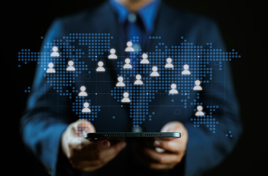 Offshoring and global remote work. Cross-border collaboration system for skilled talent. Businessperson holding world map and people icons.