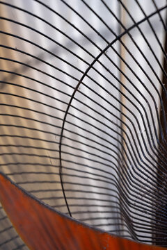 Abstract close-up of a circular wire sculpture showcasing intricate patterns.