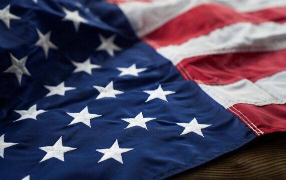 American flag on a wooden table representing freedom and democracy