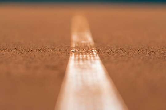 White Court Line on Clay Tennis Court with Shallow Depth of Field
