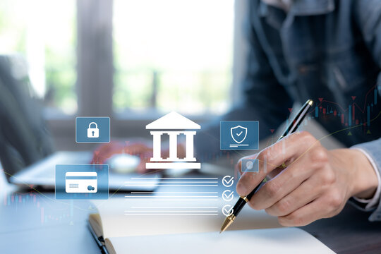 Secure banking and financial planning concept with bank, payment card and identity verification icons over a professional writing in a notebook, with market charts in the background.
