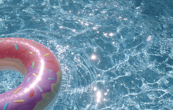 Donut inflatable swim ring floating in blue swimming pool water