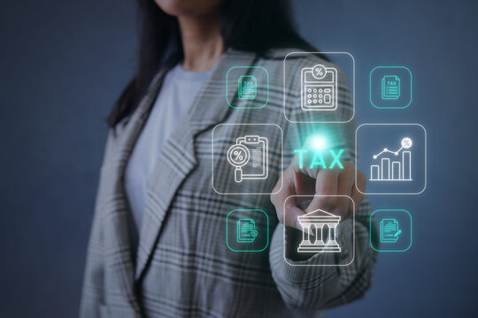 Businesswoman Touching Online Tax Filing Hologram Icons Against Grey BAckground