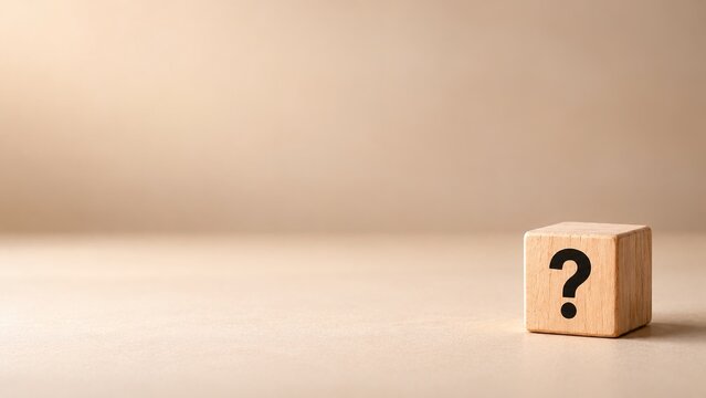 Single wooden cube with a black question mark on a minimal beige background, symbolizing frequently asked questions, customer support, information assistance, online help and knowledge discovery.