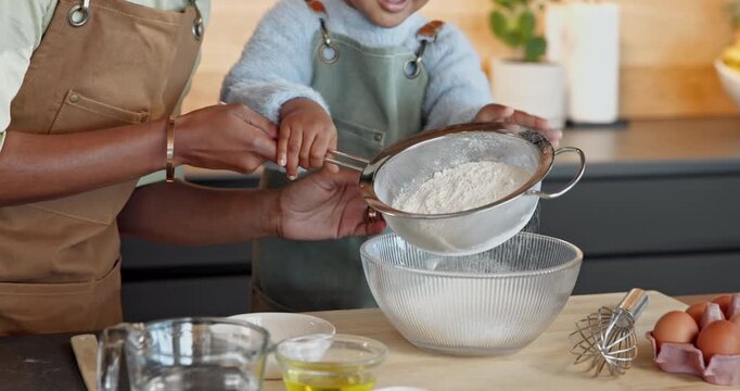 Parent, child and flour with sift for baking ingredients, home recipe or bonding together in kitchen. Guardian, junior baker or hands with kid or bowl for dessert cuisine or teaching culinary art