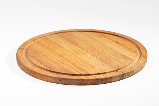 Light brown wooden circular board, empty cutting platter kitchen tool