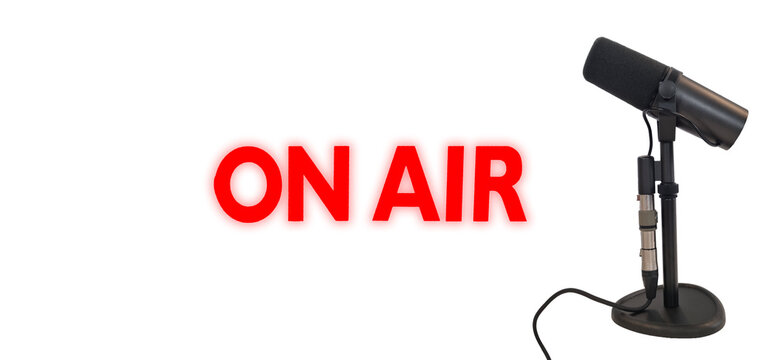vocal microphone on a white with on air lighting for podcast banner