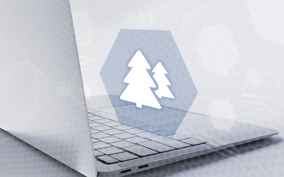 Ordenador port&aacute;til moderno con un icono ecol&oacute;gico digital en una pantalla flotante sobre interfaz futurista, ideal para proyectos de sostenibilidad y gesti&oacute;n ambiental empresarial.