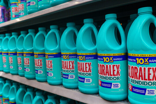 Villa de Alvarez, Colima. Mexico. June 24, 2026: Turquoise Cleaning Product Bottles Arranged on a Supermarket Shelf