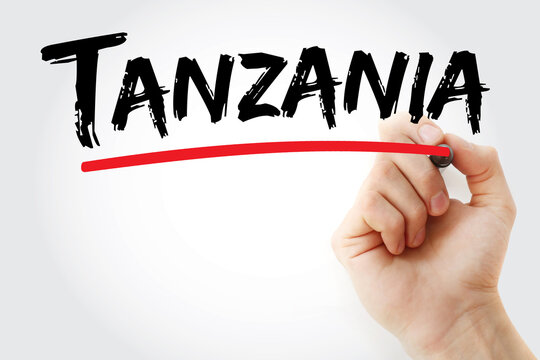 TANZANIA text on glass written by hand. Tanzania is an East African country known for its vast wilderness areas, including the Serengeti National Park and Mount Kilimanjaro