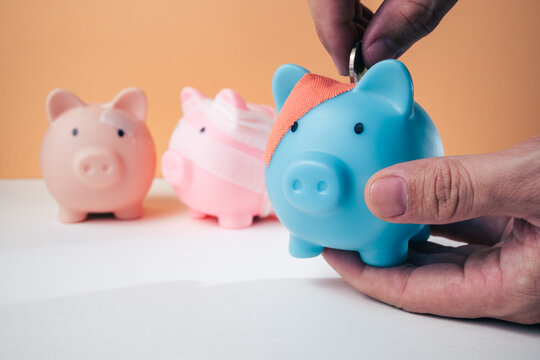 Piggy bank wrapped in a bandage on a plain background with copy space, representing financial recovery, debt relief, deposit protection, bankruptcy, business rehabilitation and a fresh start.