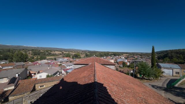 Timelapse Rooftop View Over Valley Village and Moving Church Shadows