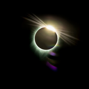 Solar eclipse with diamond ring effect over Los Angeles sky