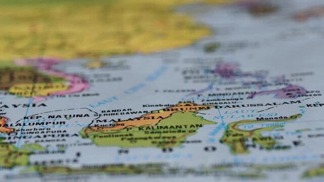 The map of the island of Kalimantan, Indonesia, shows it bordering the country of Malaysia.