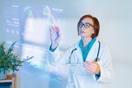 Female doctor analyzing holographic medical data indoors