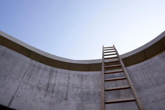 Ladder at concrete wall of an unfinished building