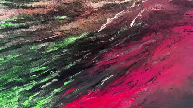 Green and red light moves across a dark water surface in an abstract reflection