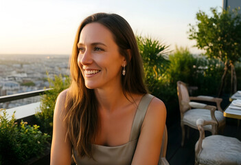 Naklejka premium Lifestyle and wellness, happy woman enjoying sunset on a rooftop terrace with city view, relaxation and leisure time in an urban outdoor setting