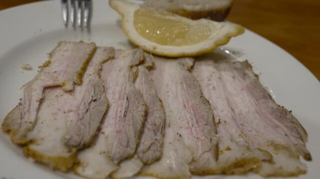 Traditional Spanish sliced cold pork tapa Carne de Mechada served without bread in Seville, Spain