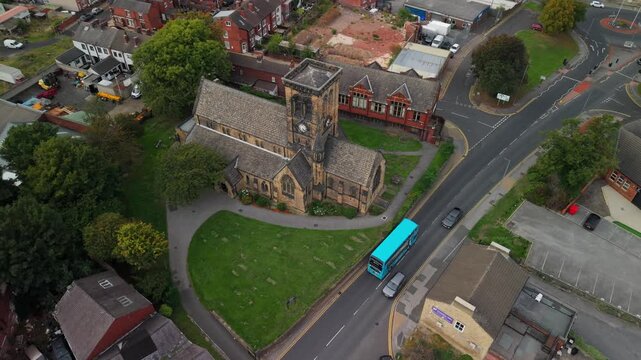 Aerial view of The Parish Church of All Saints, Castleford and surroundings with town neighborhoods. POV of West Yorkshire Town, England, United Kingdom.