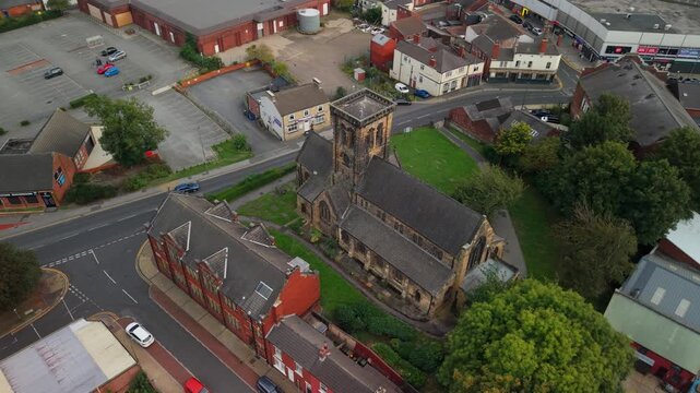 Aerial view of The Parish Church of All Saints, Castleford and surroundings with town neighborhoods. POV of West Yorkshire Town, England, United Kingdom.