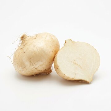 Fresh Whole and Half Sliced Jicama Root Vegetable on White Background