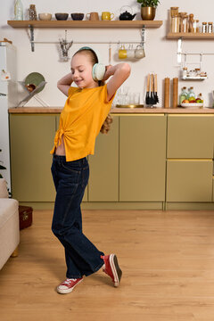 Cute preteen girl spending joyful weekend moments in a cozy home