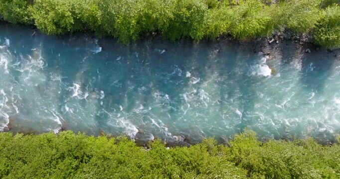 Top down view of fast moving mountain river. Nature of Canada 