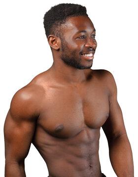 Shirtless man standing and smiling while looking to the side against a white studio background