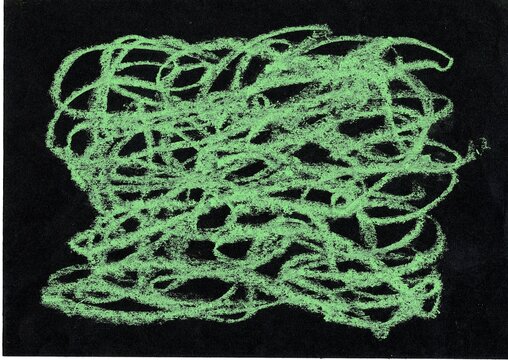 An abstract crayon scribble in colour on a black background.