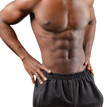Bare-chested man standing with hands on hips against a white studio background