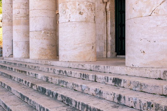 Agios Georgios church entrance with weathered steps and pale columns, Old Fortress, Corfu, Greece