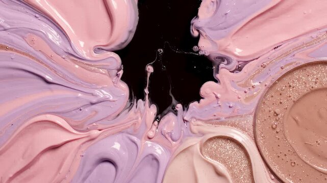 Swirling pastel cosmetic cream forming a gentle pattern on a dark surface featuring soft pink lavender and beige tones.