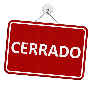 Closed red and white sign Cerrado in Spanish isolated on white