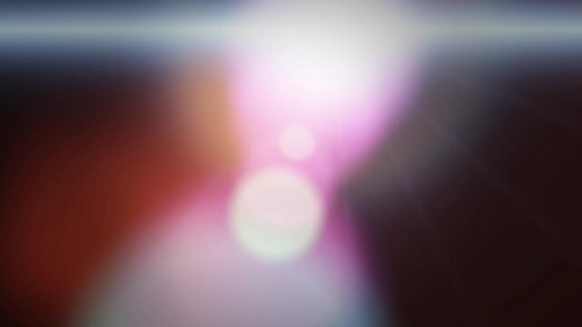 Soft pink and white light leak drifting across a dark backdrop